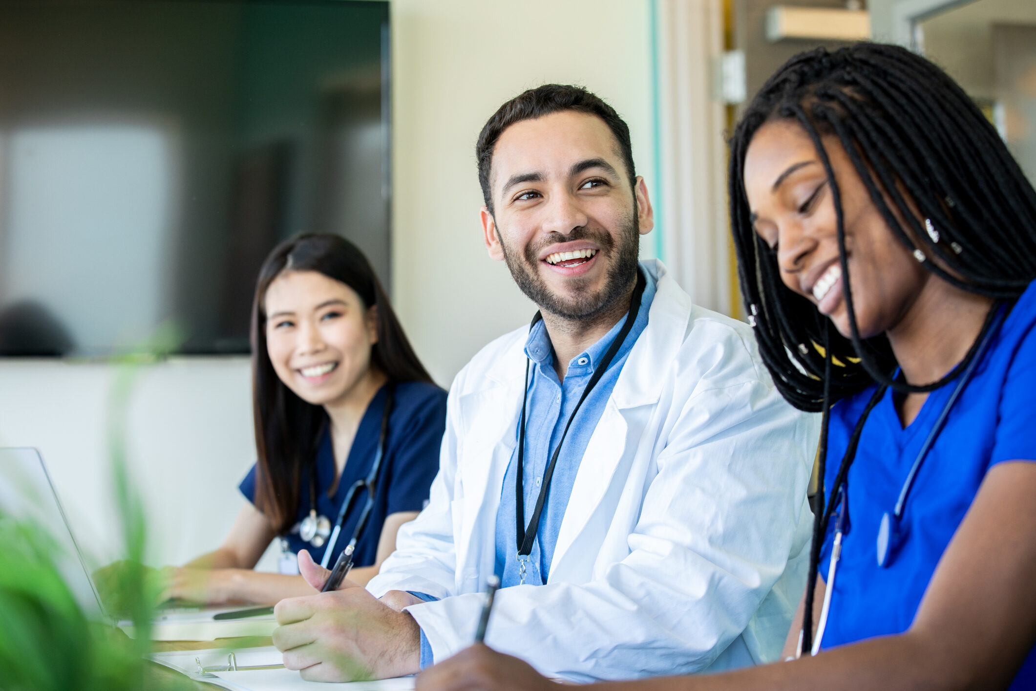 Medical Students Smile During Meeting In Conference Room
